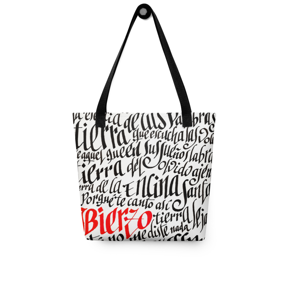 Letra de la canción de Miguel Guerrero : Bierzo tierra lejana. letras caligráficas, negras y palabra Bierzo en rojo, ilustradas en Tote bag blanca con cintas de color negro.
